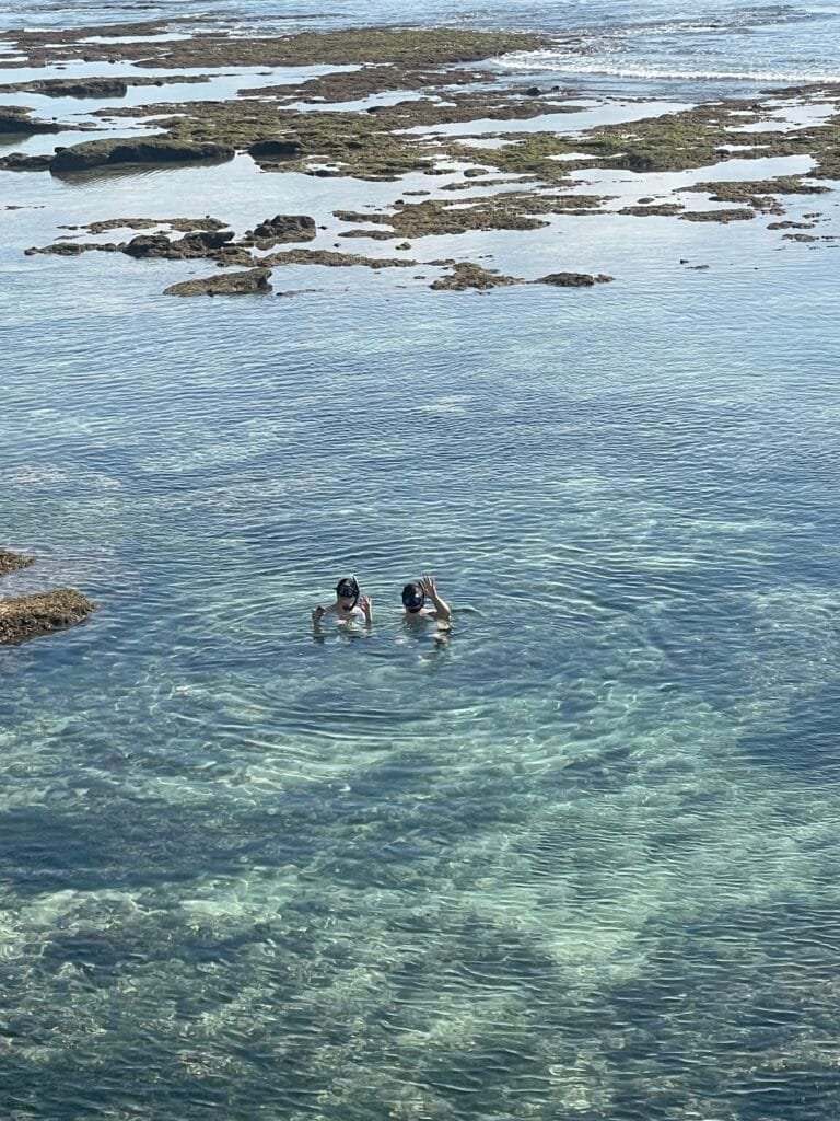 Two people snorkelling at Suluban Beach, Bali