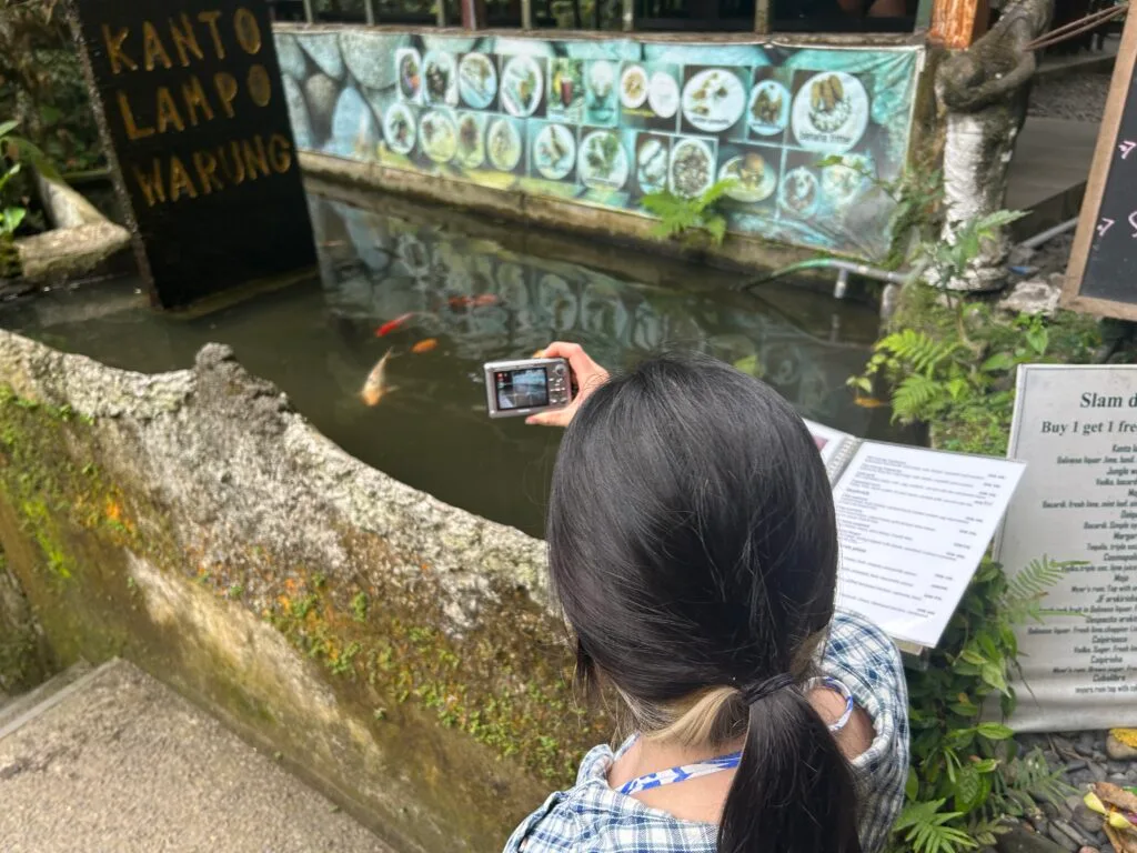 Photo of Winona taking a photo of fish