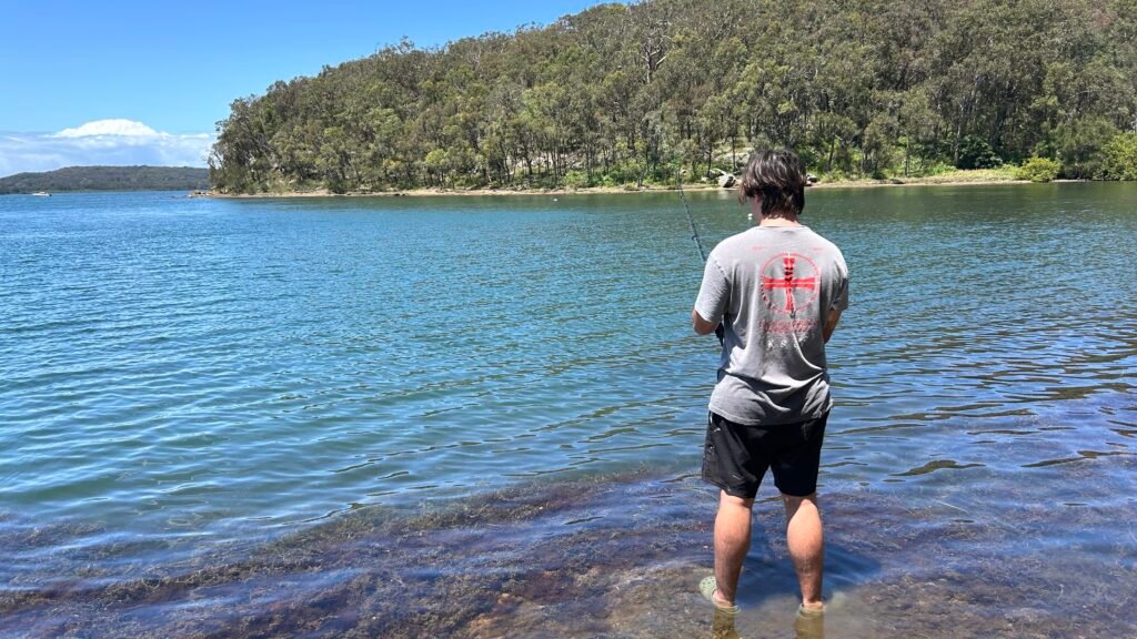 man fishing on lake macquarie